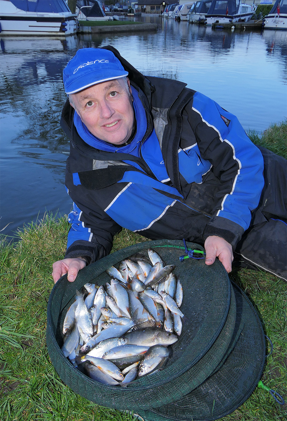 Alan with a hard-earned 6lb net of roach, hybrids and perch.