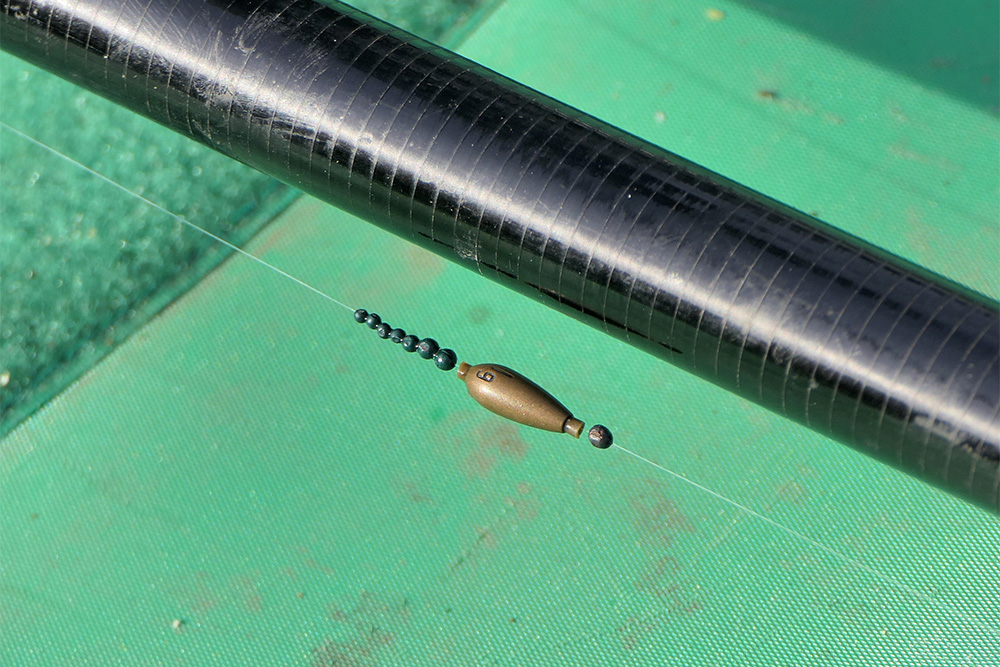 Tuning shot are used beneath the olivette to fine-tune the amount of float tip showing.