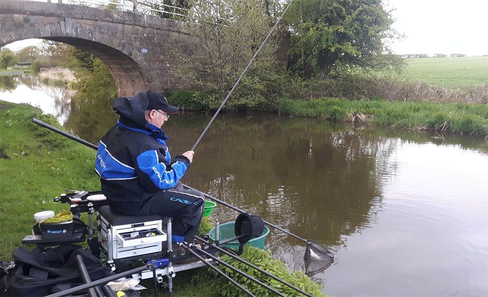 Alan pans a caster fish on the Lancaster Canal.